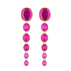 Close-up of long gold earrings featuring multi-layered rose red faceted crystal drops