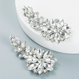 Detailed macro of silver-plated flower earrings with sparkling marquise crystal petals
