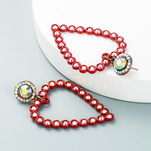 Retro heart drop earrings with red frame and sparkling crystals on a stylish display