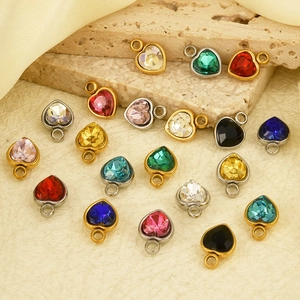 Macro view of multi-colored heart-shaped glass crystal pendants with stainless steel plating
