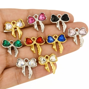 Polished bow-shaped 304 stainless steel pendants with colorful heart-cut crystals