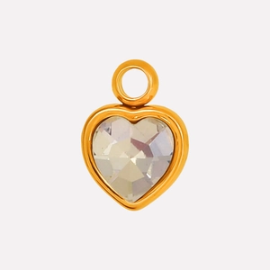 Detail of a gold-plated heart pendant with faceted glass crystal and polished metal bail