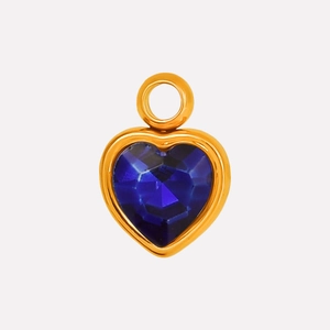 Detailed macro view of heart-shaped blue crystal pendant with gold stainless steel bezel