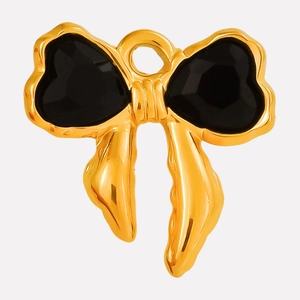 Detail of a 304 stainless steel bow pendant with gold frame and black heart elements