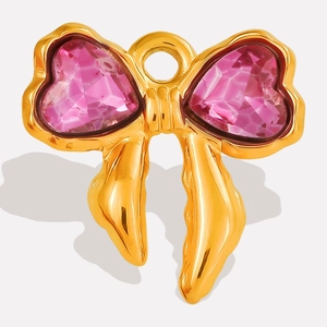Detail of 304 stainless steel gold bow pendant with pink heart-shaped crystal stone