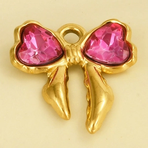 Detail of golden bow pendant with pink heart crystals and a top hanging ring