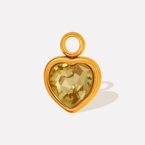 Macro shot of 304 stainless steel heart pendant with sparkling yellow crystal inlay