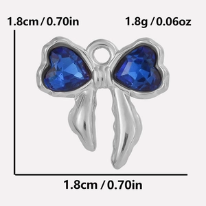 Macro view of 304 stainless steel bow pendant with heart blue stones and 1.8cm scale