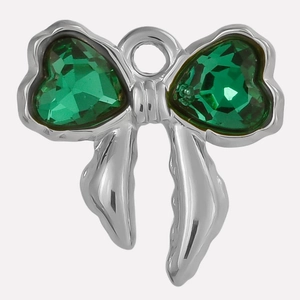 Detailed macro shot of bow pendant in 304 stainless steel with green heart crystals