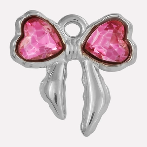 Macro shot of silver bow pendant featuring pink heart-shaped crystals for DIY jewelry