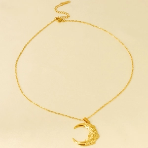 Minimalist stainless steel necklace featuring crescent moon with rose floral engraving
