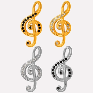 Détail de breloques en forme de clé de sol argentées et dorées avec strass pour bijoux DIY