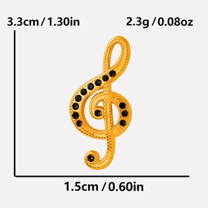 Vue détaillée du pendentif clé de sol doré avec dimensions et strass noirs sur fond gris