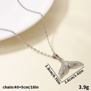 Detail of 304 stainless steel fishtail pendant with vintage engraving and measurements