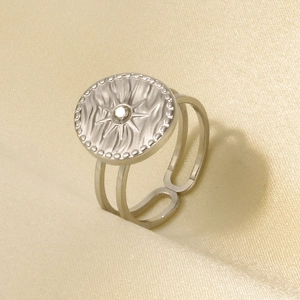 Detailed macro view of 304 stainless steel sunburst ring with crystal stone inlay