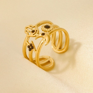 Detail of 18k gold plated stainless steel ring with Hamsa hand and celestial charms