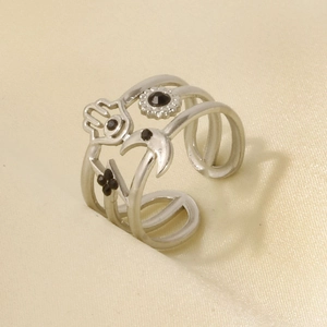 Detail of silver hollow ring with Hamsa Hand and celestial symbols with black stones