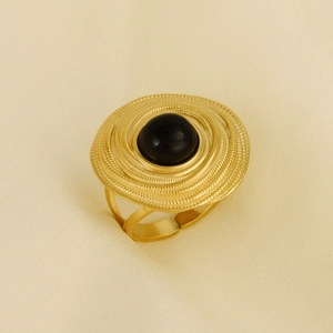Detail shot of vintage 304 stainless steel ring with black stone and spiral texture
