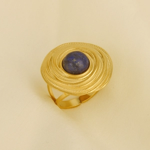 Macro detail of vintage 304 stainless steel ring with blue lapis stone inlay and spiral texture