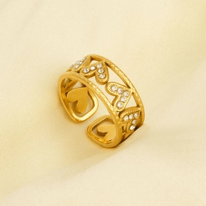 Detailed macro view of 304 stainless steel gold heart ring with pavé sparkling crystals
