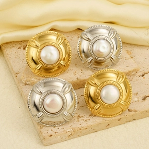 French retro pearl open ring in gold and silver finish on elegant textured background