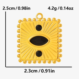 Macro detail of a vintage gold-tone sunburst square pendant with black stone inlay and beading