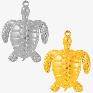 Detailed close-up of gold and silver sea turtle pendants with intricate shell textures