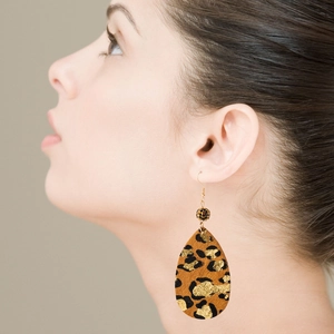 Vintage oversized leopard print teardrop earrings with sparkling rhinestones on model