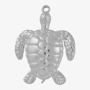 Macro shot of silver stainless steel sea turtle pendant with detailed shell texture