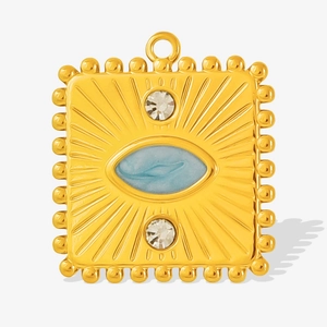 Detail of square gold pendant with blue stone and sunburst engraving for DIY jewelry