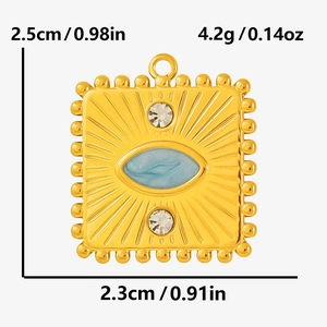 Detailed macro view of a vintage gold pendant with blue resin and clear crystal accents