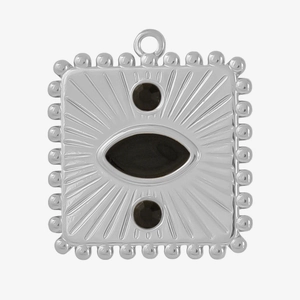 Macro detail of square stainless steel pendant with radial texture and black stone inlay