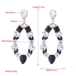 Exaggerated geometric teardrop earrings with crystals and rhinestones in gold and black