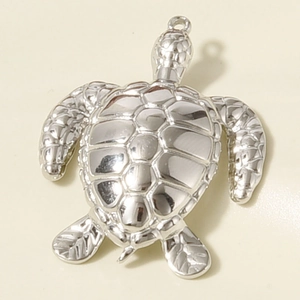 Polished 304 stainless steel sea turtle pendant detail showing shell texture and ring