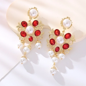 Vintage style drop earrings with red gemstones, pearls, and gold-plated floral frame