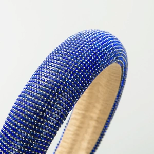 Padded headband with deep blue rhinestones and non-slip velvet lining in baroque style