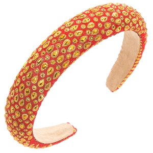 Macro detail of luxury baroque headband with red beads and golden crystal embroidery