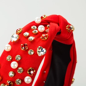 Red knotted wide headband with pearls and crystals for a sophisticated vintage aesthetic
