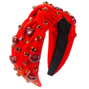 Fashionable red knotted headband with heart-shaped stones and sparkly rhinestones