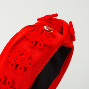 Red knotted headband with Chinese knot accents and sparkling rhinestones for women