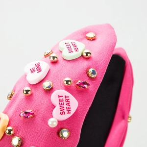 Pink padded headband with heart charms, colorful rhinestones and pearls for women