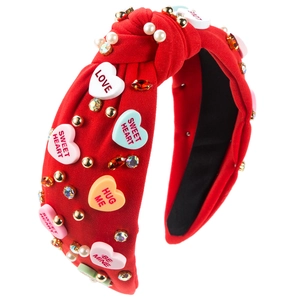 Red knotted headband with heart candy patches, pearls, and colorful rhinestones for women