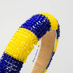 Handmade beaded headband featuring blue and yellow crystals with a non-slip suede lining