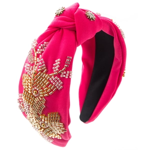 Detail of rose red fabric headband featuring handmade gold beads and sequins embroidery