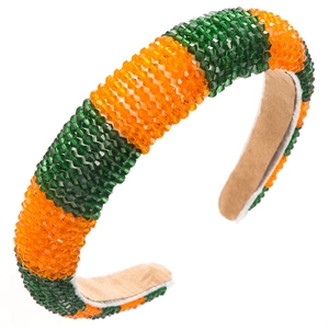 Detailed view of the wide headband featuring orange and green faceted crystal beads