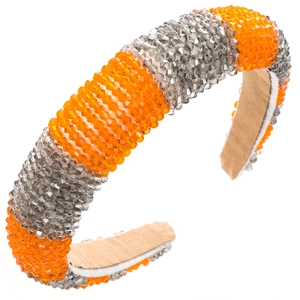 Detailed view of thick headband with orange and grey crystal beads in striped pattern