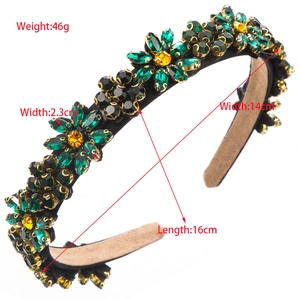 Elegant wide headband with green and amber rhinestone flowers on black fabric base