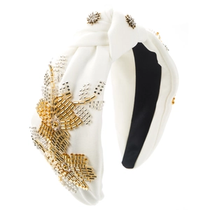 White fabric knotted headband with intricate gold and silver beadwork and star rhinestones