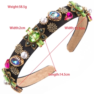 Retro vintage headband with emerald crystals, pearls and gold flowers on black satin