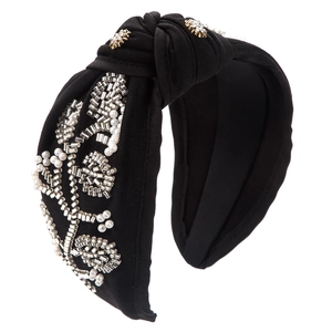 Detail showing hand-sewn pearls and silver beads on a black knotted fashion headband